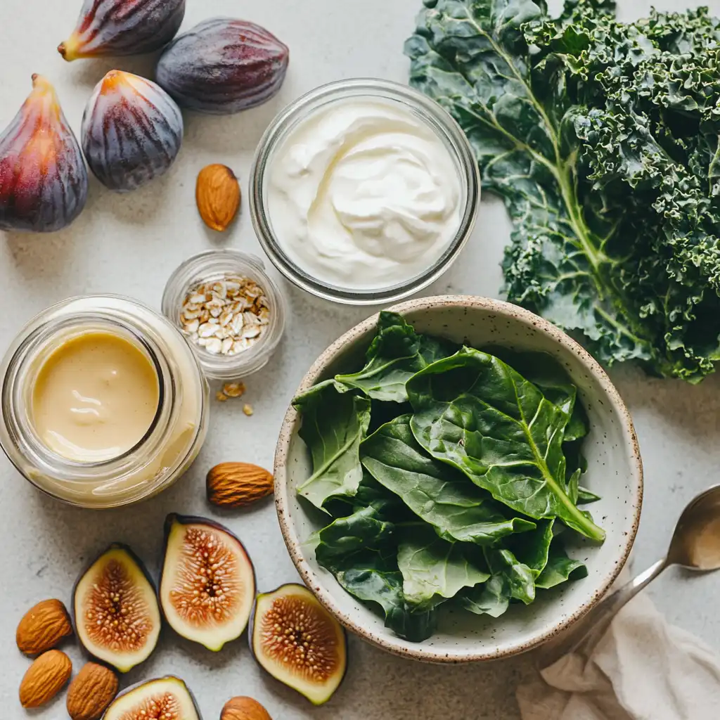 An assortment of calcium-rich foods including kale, figs, almonds, tahini, yogurt, and oats, arranged on a light background for a pregnancy-friendly diet.
